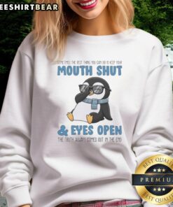 Premium Penguin sweatshirt with the quote 'Sometimes the best thing you can do is keep your mouth shut and eyes open.'