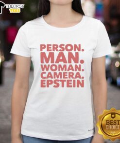 Premium person wearing Epstein ladies tee, posing with a camera, showcasing stylish casual wear for men and women.