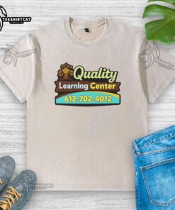 Premium quality Learning Center washed t-shirt displayed on a wooden table, showcasing its soft fabric and stylish design.