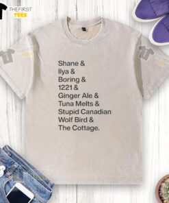 Alt Text: Premium Shane Ilya Boring ginger ale t-shirt featuring a whimsical Canadian wolf bird design, perfect for cottage wear.