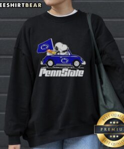 Premium Snoopy and Woodstock driving Penn State Nittany Lions sweatshirt, perfect for fans and cozy gameday wear.