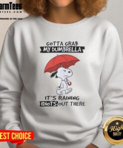 Premium Snoopy sweatshirt featuring 'Gotta Grab My Dumbrella, It's Raining Idiots Out There' design in vibrant colors.