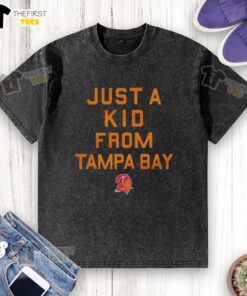 Alt Text: Premium Tampa Bay Buccaneers Just A Kid From Tampa Bay washed t-shirt displayed on a wooden background.