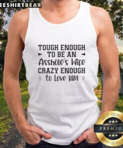 Alt Text: Premium tough enough to be an asshole's wife crazy enough to love him text tank top displayed on a mannequin.