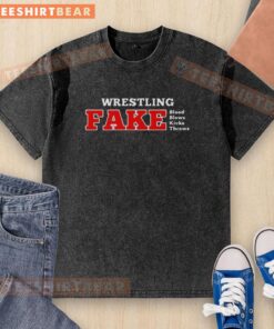 Premium Wrestling Fake Blood design on a washed t-shirt featuring dynamic blows, kicks, and throws for wrestling fans.