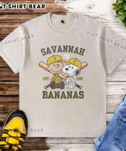 Alt Text: Charlie Brown and Snoopy in Savannah Bananas outfit on a washed t-shirt, celebrating Est. 2016 style.