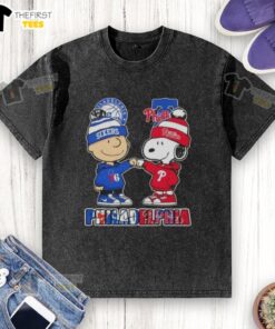 Pretty Charlie Brown fist bump with Snoopy on a Philadelphia sports t-shirt featuring 76ers and Phillies logos.