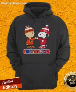 Pretty Charlie Brown Fist Bump with Snoopy on a Philadelphia City Sports Phillies X Flyers hoodie.