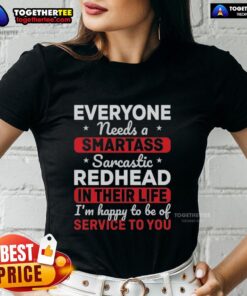 Funny redhead wearing a sarcastic tee saying 'Everyone Needs A Smartass' perfect for witty womens fashion.