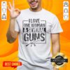 Vintage 'I Love One Woman And Several Guns' T-shirt design featuring bold graphics and a playful message.