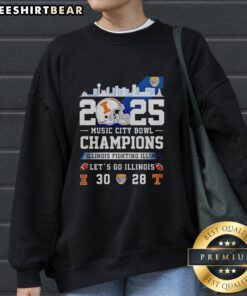 Pretty Illinois Fighting Illini Music City Bowl Champions 2025 sweatshirt in vibrant colors, celebrating team spirit.