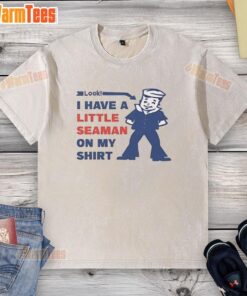 Woman wearing a washed t-shirt with a playful seaman graphic, showcasing a stylish and casual look.