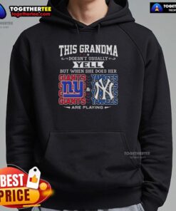 Alt Text: Grandma in a hoodie supporting the New York Giants and Yankees, showcasing her team spirit with a joyful yell.