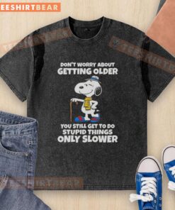 Alt Text: Pretty Snoopy graphic on a washed t-shirt with a humorous quote about aging and doing silly things.