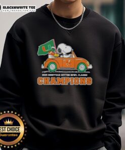Alt Text: Snoopy driving a car in Miami Hurricanes football sweatshirt celebrating Top 2025 Goodyear Cotton Bowl Classic Champions.