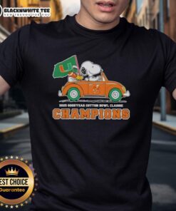 Top 2025 Goodyear Cotton Bowl Classic Champions T-shirt featuring Snoopy driving a car with Miami Hurricanes football theme.