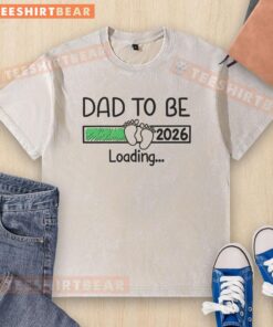 Top Dad To Be 2026 loading graphic on a washed t-shirt, perfect gift for expecting fathers celebrating fatherhood.