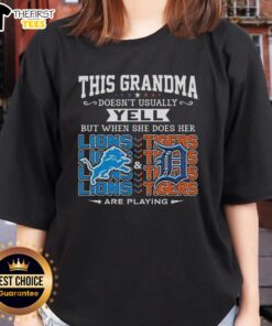 Grandma wearing a Detroit Lions and Tigers tee, smiling and cheering, showcasing her team spirit and love for sports.