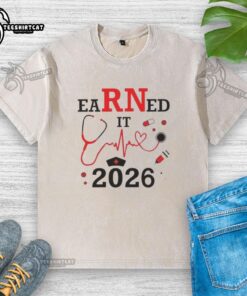 Top Earned It RN Registered Nurse 2026 washed t-shirt featuring a stylish design for proud nurses.