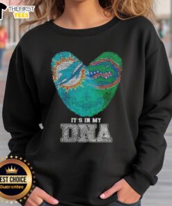 Miami Dolphins and Florida Gators sweatshirt featuring 'It's In My DNA' design, perfect for sports fans and alumni.