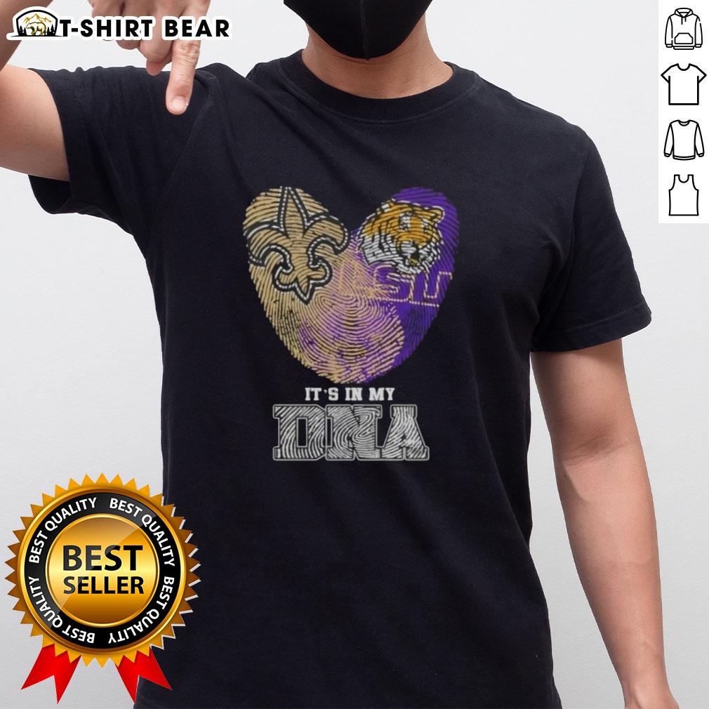 Top Fingerprints New Orleans Saints X Lsu Tigers It'S In My Dna T Shirt Alt Text: Top Fingerprints New Orleans Saints X LSU Tigers It's In My DNA T-Shirt featuring bold team logos and vibrant design.