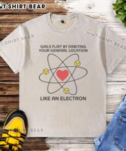 Stylish washed T-shirt featuring 'Top Girls Flirt By Orbiting Your General Location Like An Electron' graphic design.