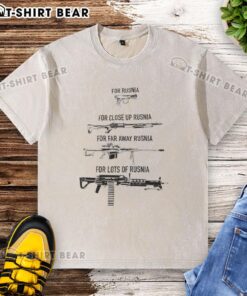 Close-up of a washed 'Top Gun for Rusnia' t-shirt, featuring vibrant graphics and a stylish design for casual wear.