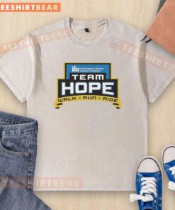 Alt Text: Team Hope Walk participants wearing washed t-shirts from the Huntington's Disease Society of America Iowa Chapter event.