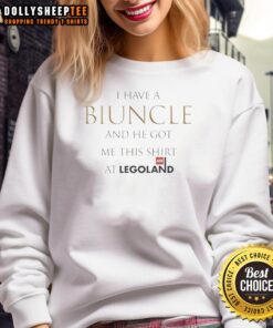 Child wearing a sweatshirt that says 'I have a biuncle and he got me this shirt' at Legoland, showcasing fun family moments.