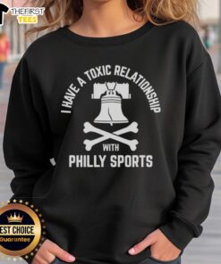 Cozy sweatshirt featuring 'I Have A Toxic Relationship With Philly Sports' design, perfect for football fans.