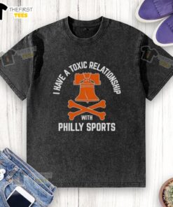 Top I Have A Toxic Relationship With Philly Sports Hockey Washed T-Shirt displayed on a hanger, showcasing its unique design.