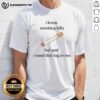 Top I Know Smoking Kills But God I Need This Fag In Me T-Shirt design featuring bold text and a casual style.