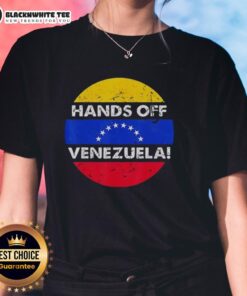 Alt Text: Retro ladies tee featuring 'Stand With Hands Off Venezuela' flag design in a circular graphic.