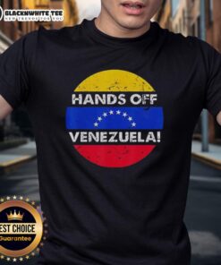 Retro T-shirt featuring 'I Stand With Hands Off Venezuela' slogan in a circular flag design.