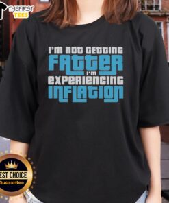 Funny ladies tee with 'I'm Not Getting Fatter, I'm Experiencing Inflation' print, perfect for humorous fashion lovers.