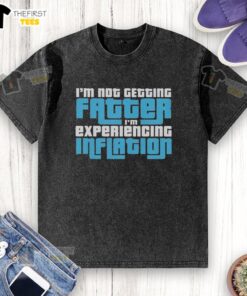 Casual washed t-shirt with 'I'm not getting fatter, I'm experiencing inflation' slogan, perfect for humorous fashion lovers.
