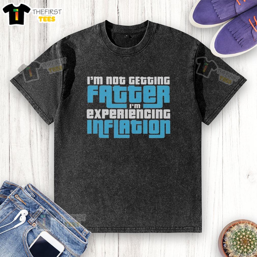 top-im-not-getting-fatter-im-experiencing-inflation-washed-t-shirt Casual washed t-shirt with 'I'm not getting fatter, I'm experiencing inflation' slogan, perfect for humorous fashion lovers.