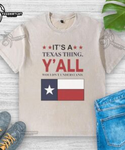 Top It's a Texas Thing Y'all Wouldn't Understand flag washed t-shirt with vibrant Texas flag design.