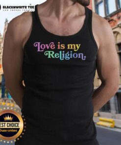 Alt Text: John Pavlovitz wearing a Patriot Love Is My Religion tank top, promoting love and unity in a vibrant setting.