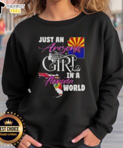 Cozy 'Just An Arizona Girl In A Florida World' sweatshirt displayed on a hanger, perfect for casual wear.