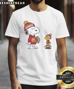 Alt Text: Top Kansas City Chiefs Snoopy Woodstock Football NFL T-Shirt featuring vibrant graphics of Snoopy and Woodstock in team colors.