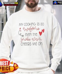 Cozy sweatshirt featuring 'My Cooking Is So Qwesothe, Even The Smoke Alarm Cheers Me On' design, perfect for culinary enthusiasts.