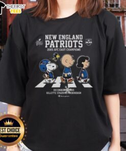Top New England Patriots 2025 AFC East Champions Snoopy and Peanuts Abbey Road ladies tee design featuring iconic characters.