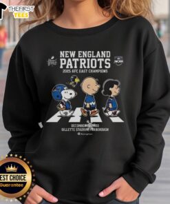 New England Patriots 2025 AFC East Champions sweatshirt featuring Snoopy and Peanuts on Abbey Road design.