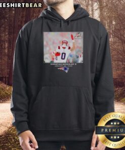 Christian Gonzalez in a New England Patriots hoodie, showcasing NFL style for 2026 season.