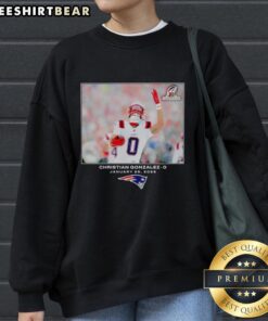 2026 NFL photo of Christian Gonzalez in a New England Patriots sweatshirt, showcasing team pride and style.