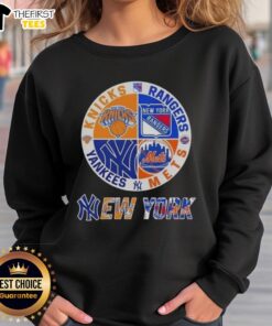 Top New York City sports sweatshirt featuring Knicks, Rangers, Mets, and Yankees logos for fans.