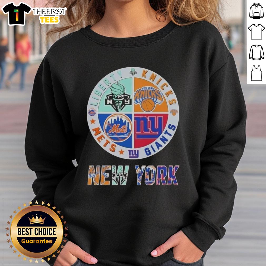 top-new-york-city-sports-liberty-knicks-giants-mets-logos-combine-sweatshirt Alt Text: Top New York City Sports sweatshirt featuring logos of Liberty, Knicks, Giants, and Mets for fans.