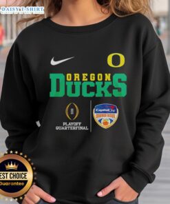 Alt Text: Top Oregon Ducks NCAA 2026 Cotton Bowl Champions sweatshirt featuring team logo and championship graphics.