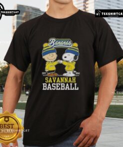 Alt Text: Top Peanuts Charlie Brown and Snoopy Savannah Bananas baseball T-shirt, established 2016, featuring vibrant graphics.